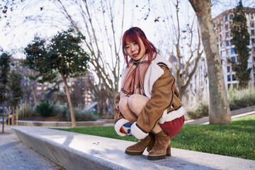 asian woman waiting in squatting position