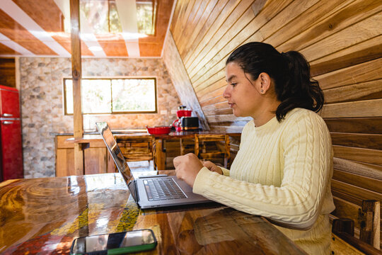 Woman sitting at a table with a computer