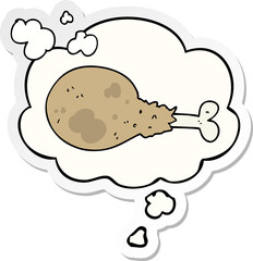 cartoon cooked chicken leg and thought bubble as a printed sticker