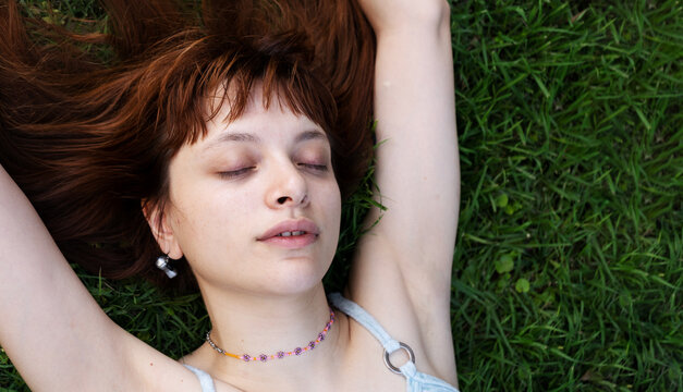 Beautiful woman lying grass