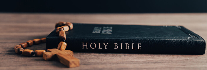 wooden Christian cross on bible