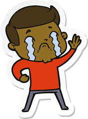 sticker of a cartoon man crying