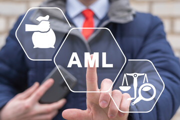 Businessman using virtual touchscreen presses abbreviation: AML. AML Anti Money Laundering Finance Business Concept. Fighting illegal dirty money flow. Stop of corruption and bribery.