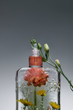 skin rejuvenation with ice massage and cosmetics beige background