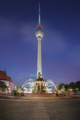 TV Tower (Fernsehturm) at night and Neptune Fountain - Berlin, Germany