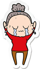sticker of a cartoon old woman crying