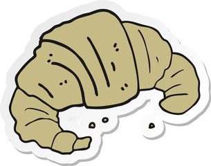 sticker of a cartoon croissant