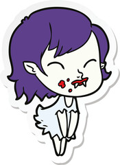 sticker of a cartoon vampire girl with blood on cheek