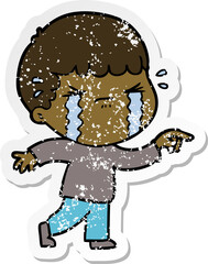 distressed sticker of a cartoon man crying