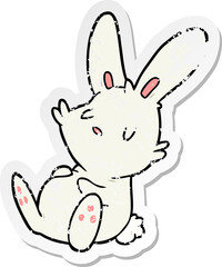 distressed sticker of a cartoon rabbit sleeping
