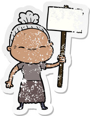 distressed sticker of a cartoon peaceful old woman