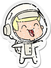 distressed sticker of a happy cartoon astronaut