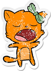 distressed sticker of a cartoon singing cat
