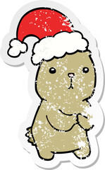 distressed sticker of a cartoon christmas bear worrying