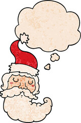 cartoon santa face and thought bubble in grunge texture pattern style
