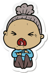 sticker of a cartoon angry old woman