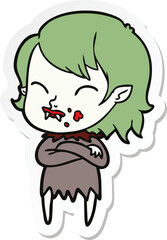 sticker of a cartoon vampire girl with blood on cheek