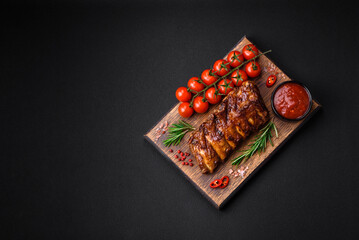 Delicious grilled pork ribs with sauce, spices and herbs