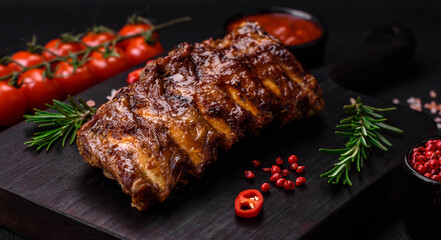 Delicious grilled pork ribs with sauce, spices and herbs