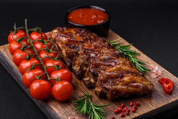 Delicious grilled pork ribs with sauce, spices and herbs