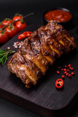 Delicious grilled pork ribs with sauce, spices and herbs