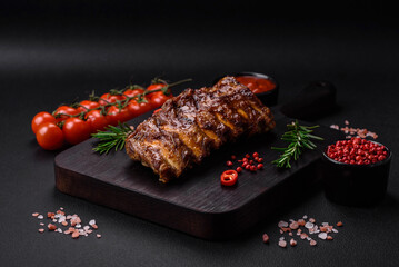 Delicious grilled pork ribs with sauce, spices and herbs