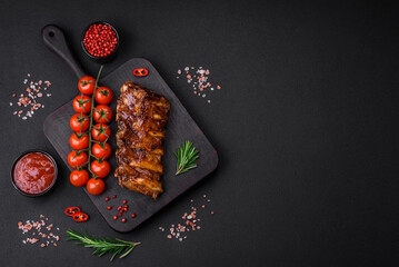 Delicious grilled pork ribs with sauce, spices and herbs