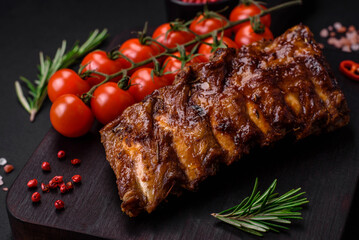 Delicious grilled pork ribs with sauce, spices and herbs
