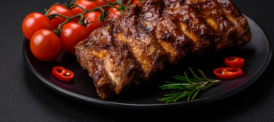Delicious grilled pork ribs with sauce, spices and herbs