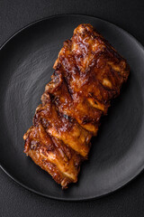 Delicious grilled pork ribs with sauce, spices and herbs