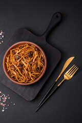Delicious noodles or udon with mushrooms, salt, spices and herbs