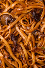 Delicious noodles or udon with mushrooms, salt, spices and herbs