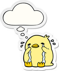 cartoon crying bird and thought bubble as a printed sticker