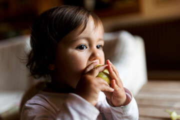 toddler eating fruits