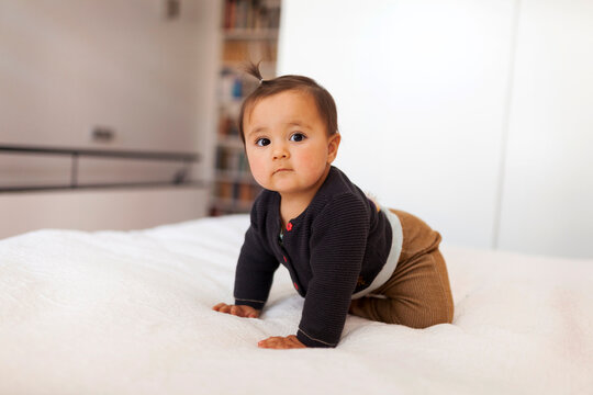 BABY CRAWLING ON BED