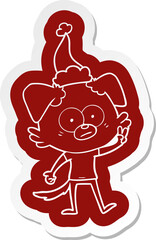 nervous dog in t shirt wearing santa hat