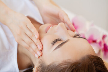 Young woman getting spa massage treatment at beauty spa salon