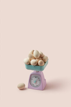 Handmade wooden Easter eggs on retro scales.