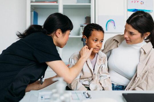 Woman and Her Little Son on Checkup