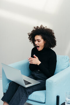 Delighted black woman freelancer.