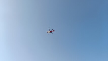 Helicopter Flying In The Clean Blue Sky