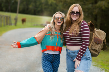 Two happy women during travel in nature portrait