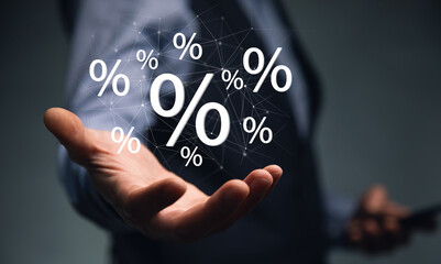 hand touches virtual percent icon.