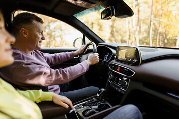 Man and woman talking in the car