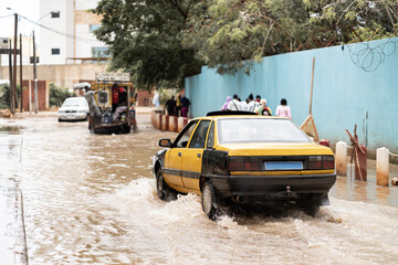 car passing through flooded road in africa