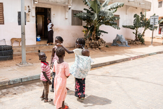 children walking in the streets of senegal