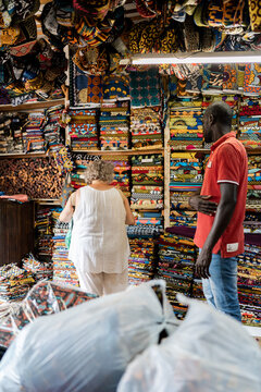 couple buying fabrics in textile store