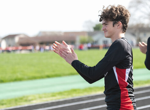 Highschool boy running track