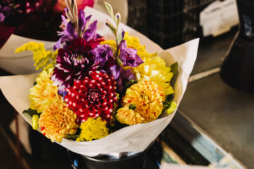 Beautiful fall floral composition on the market close-up.