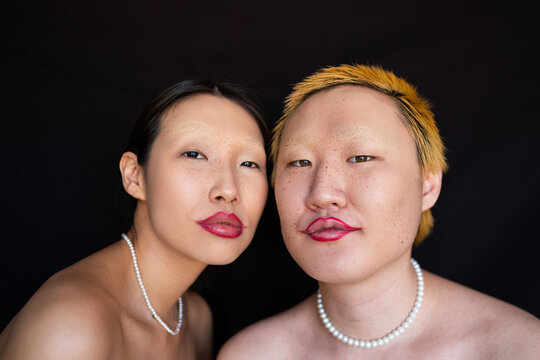 Topless fashion people with makeup